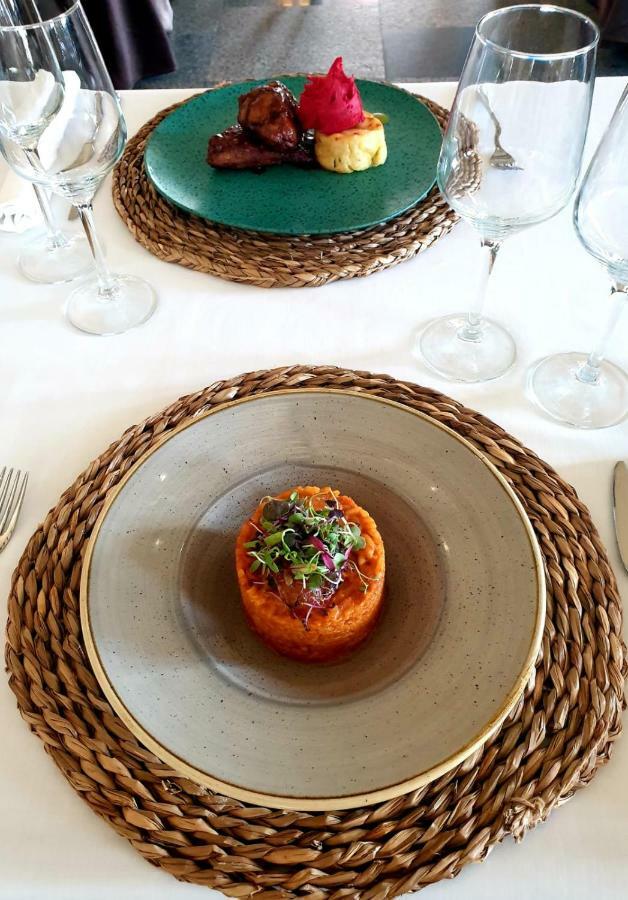 Hospes Palacio De Arenales & Spa Cáceres Exterior photo A plate of carrot and coriander soup